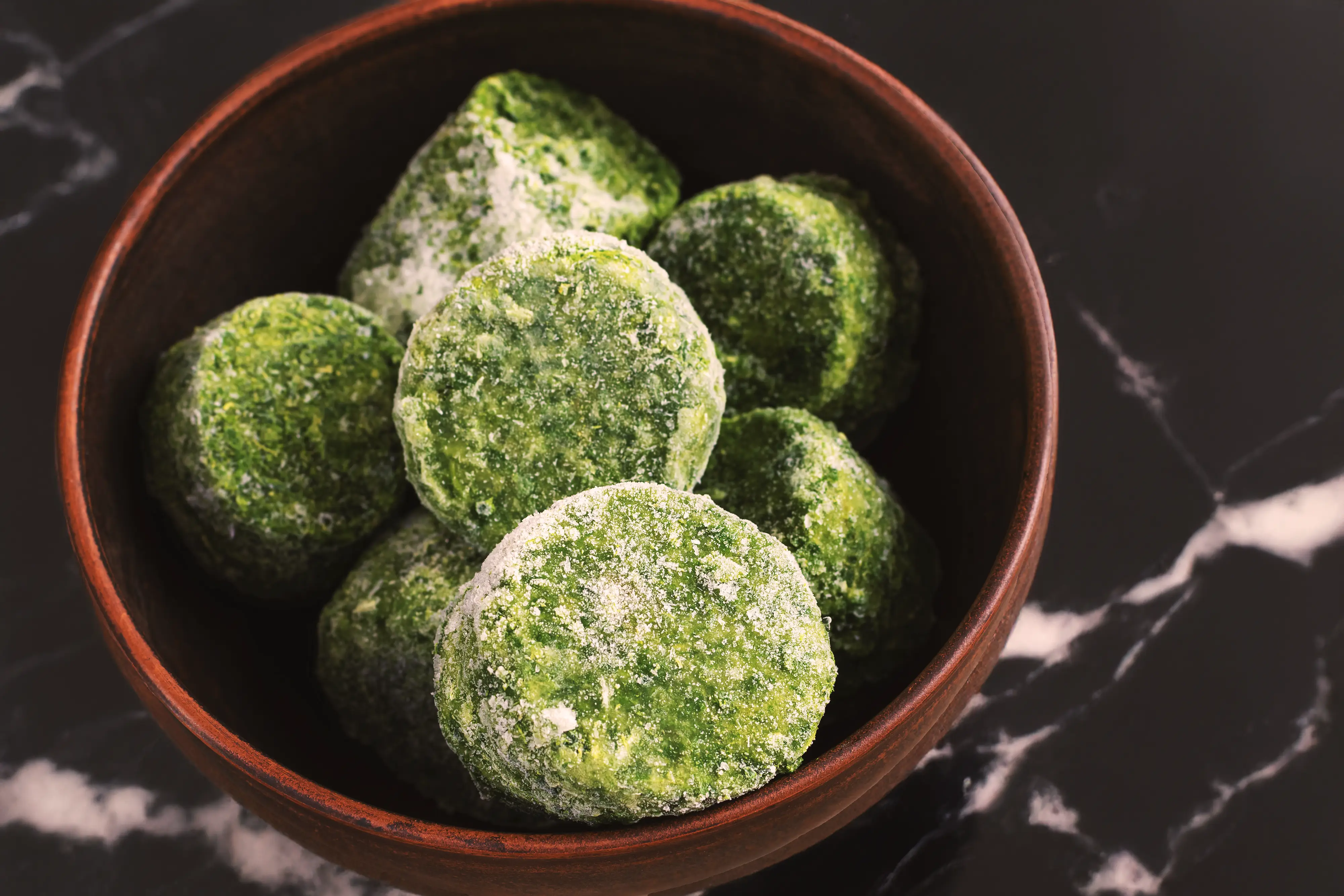Japanese matcha dessert balls dusted with powdered sugar