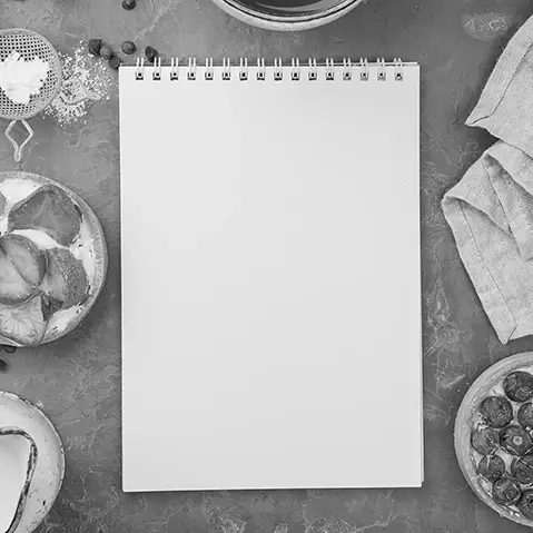 Blank recipe notebook on a kitchen table